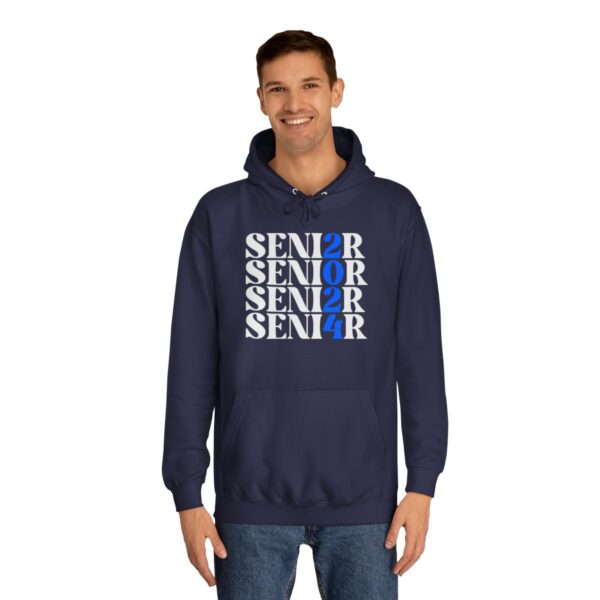 A smiling man wearing a dark blue hoodie with the word "SENIOR" repeated in different sizes and orientations, with the letter "O" replaced by the number "2" in one instance.