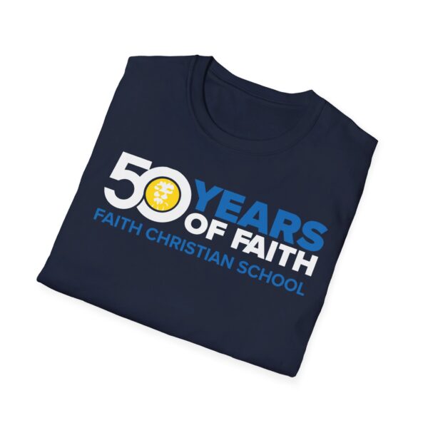 Folded navy blue T-shirt with "50 YEARS OF FAITH" in white lettering, accompanied by the emblem of a yellow sun and text underneath "FAITH CHRISTIAN SCHOOL" on a plain background.