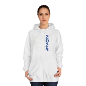 A woman wearing a white hoodie with "SENIOR 2024" printed on it standing against a plain background.