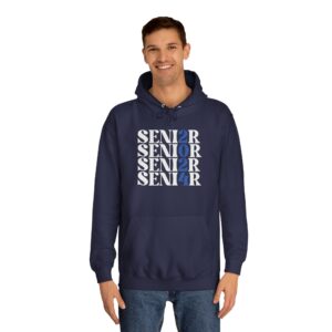 A smiling man wearing a navy blue hoodie with the word "SENIOR" printed multiple times in different shades of blue and white, with the letter 'I' replaced by the number '2' in some instances. He's also wearing jeans.