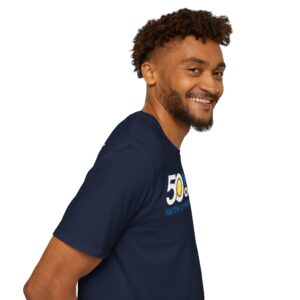 A smiling man with curly hair looking to the side, wearing a navy-blue t-shirt with the number 50 and some text on it.